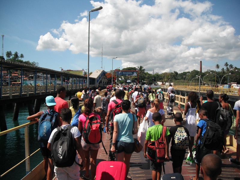 Leaving the ferry, hurrying to queue for the bus