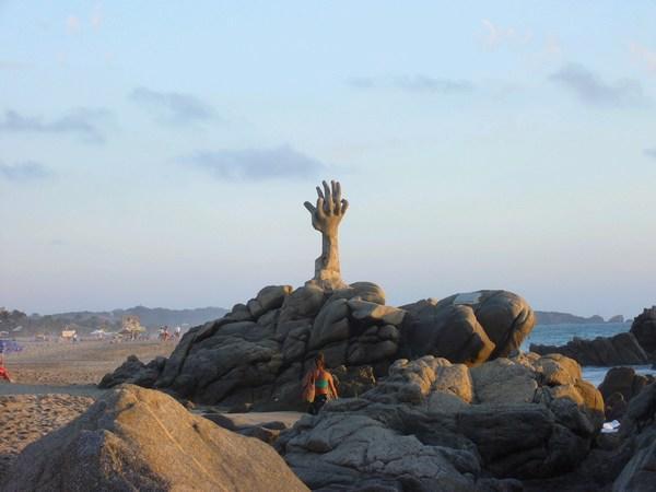 Big hands sculpture on Zicatela beach