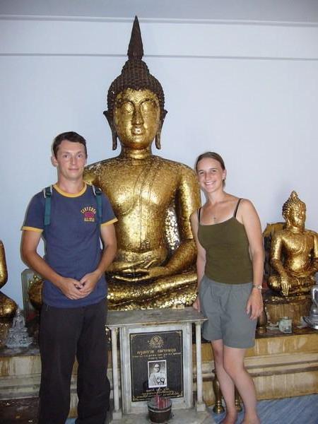 Us with a Buddha we stuck gold pieces on