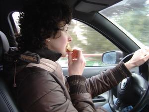 Adka eating and driving (yea...it is a scary thought)!