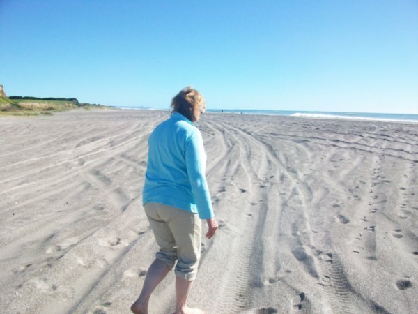 mom walking on the beach