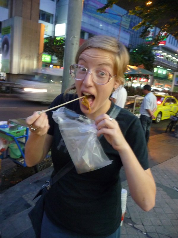Eating the squid on a stick