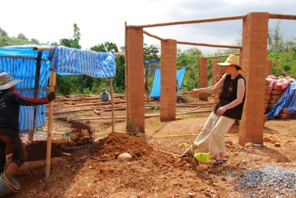 Gayle sieving the soil for the mud bricks