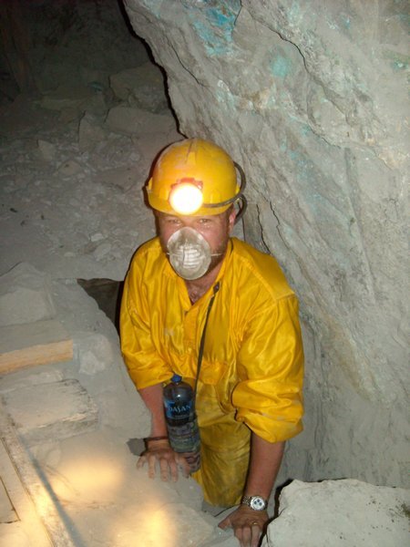 Dave Squeezing Through One of the Mine's Narrow Shafts