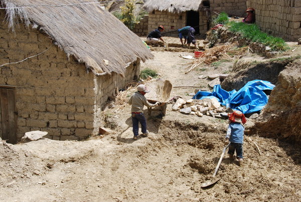 Kids Helping to make Mud Bricks for Their New Home