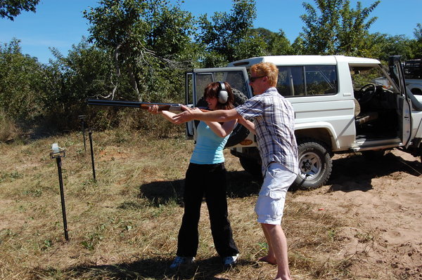 Grant showing Jenny how to shoot