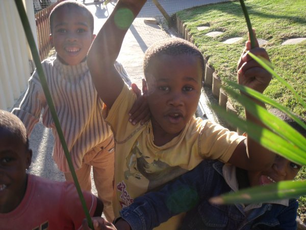 Joyful township kids playing at the community hall