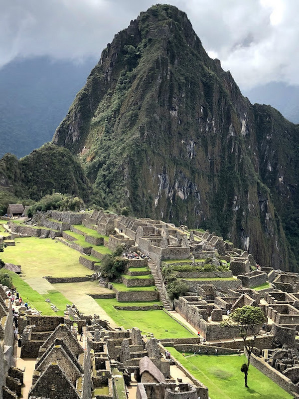 Huayna Picchu towering over the Inca city of Machu Picchu