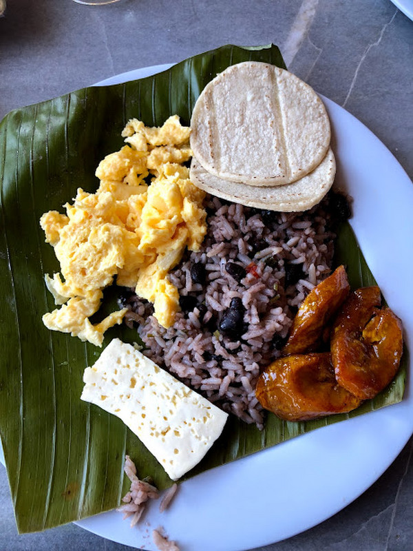 gallo pinto for breakfast with scrambled eggs, corn tortilla, sweetened banana and cheese - yumm