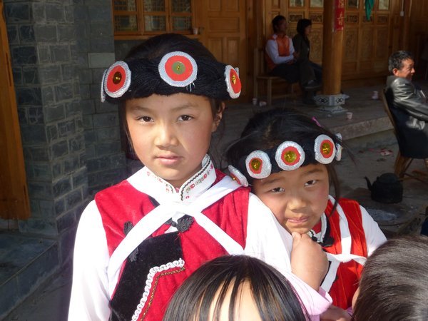 Naxi children in traditional dress at the wedding