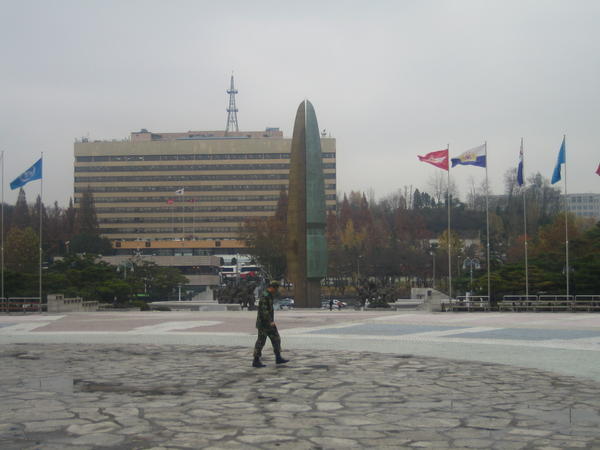 A soldier walking across the War Memorial