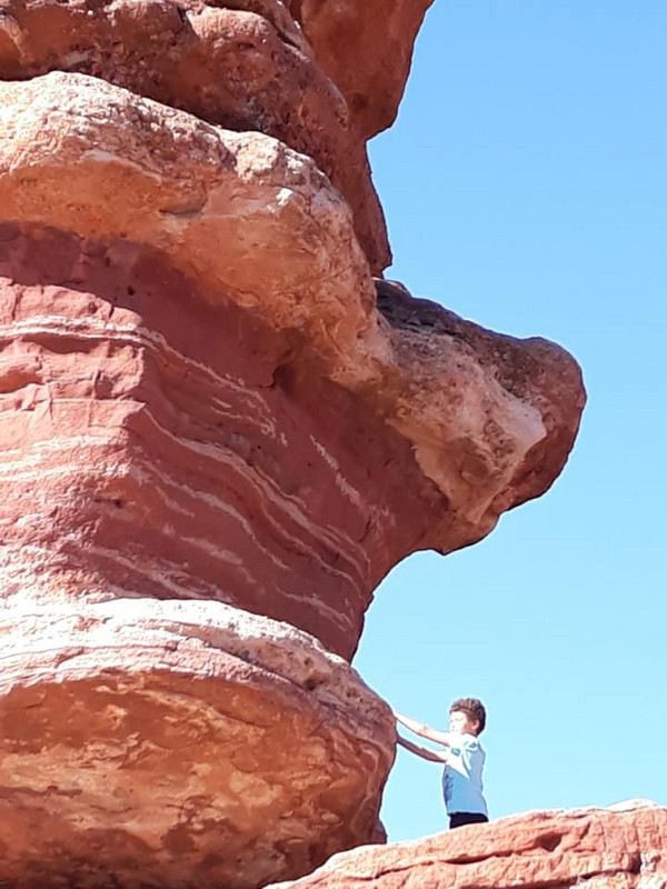 Liam at Balanced Rock in the Garden of the Gods