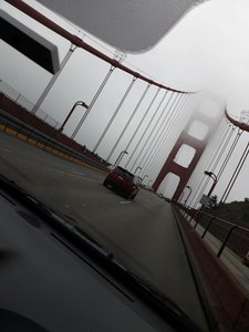 A terrible picture of a fog enshrouded Golden Gate Bridge