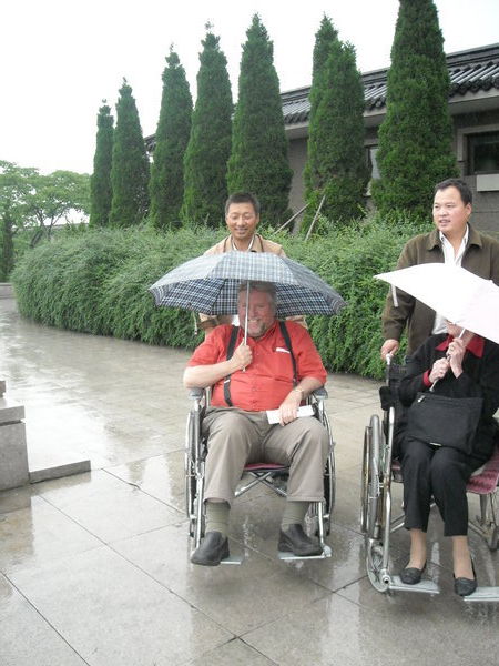 Bob in wheelchair with umbrella