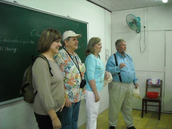 Ruth, John, Bob, and Barb singing for a class