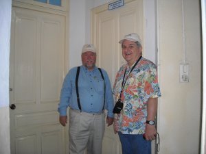 Bob and Johnny in front of the bedroom door of upper floor of main building where they roomed together in first grade