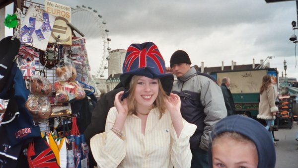 Rosanna trying on a hat at Westminster Bridge