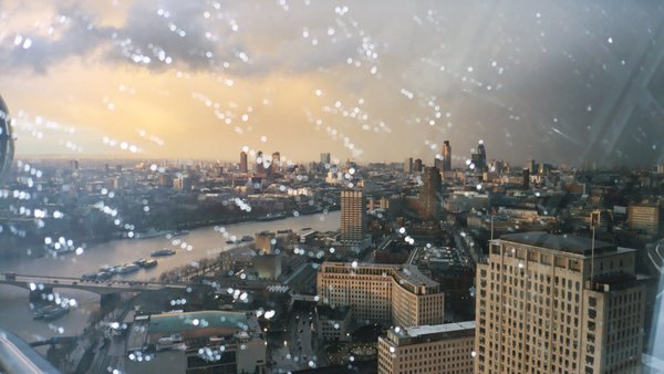 View of London in storm at sunset from London Eye