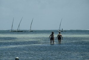 Linda and Carol wading in the Indian Ocean at Mombasa