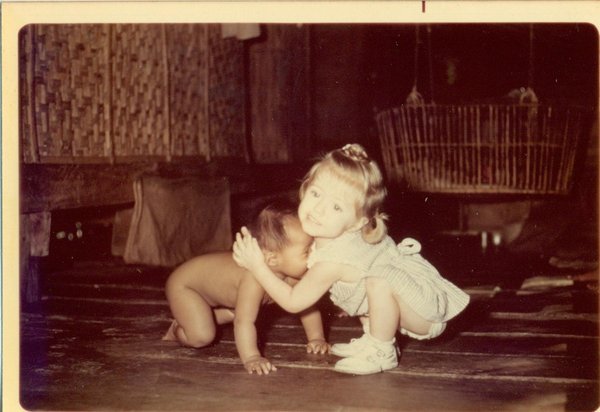 Sue hugging the neighbor's baby