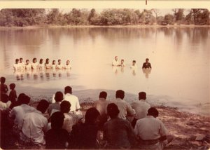 Dad performing baptisms of new converts
