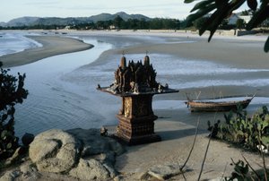 Spirit house at the end of the beach at the base of Khao Takiep mountain