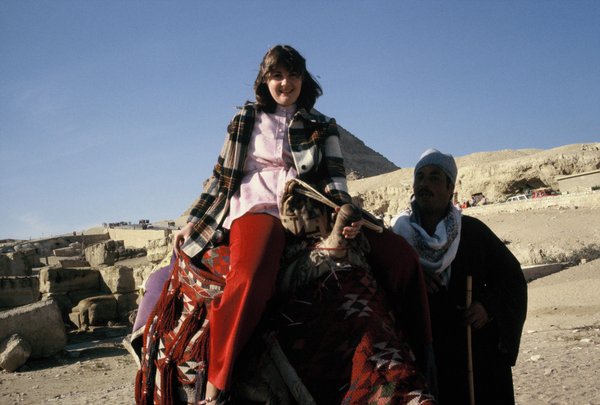 Linda on camel in front of a pyramid