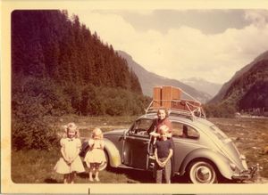 Sue, Judy, Bob and Mom with our VW somewhere in the Rockies
