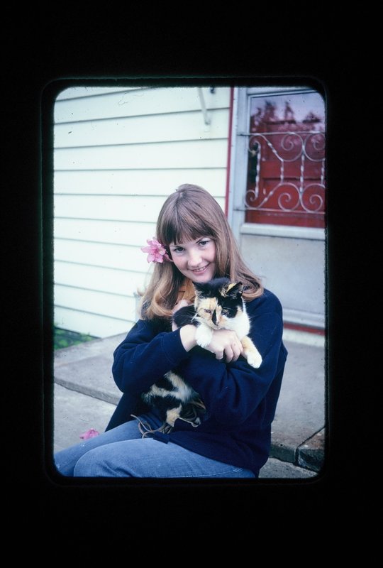 Linda and her cat Snaggelpuss on her home back steps