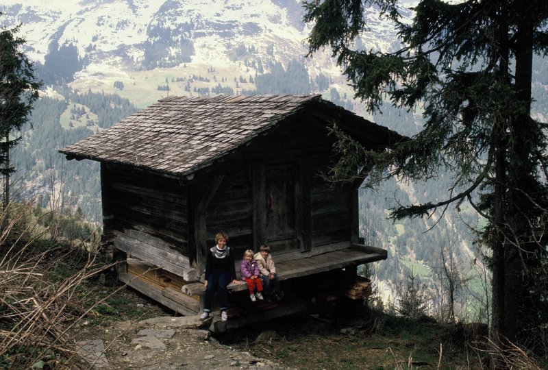 Sue Alyssa and Brendan resting at a mountain cabin