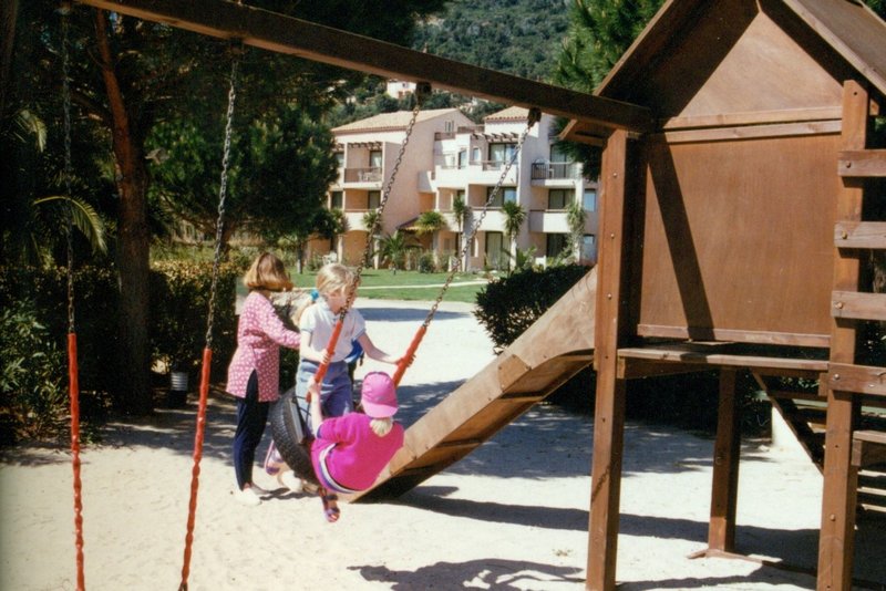Tamara and Rosanna on the swing at our resort