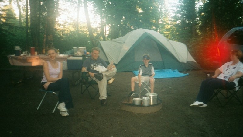 Tamara, Bob, Will, and Linda sitting around the camp fire