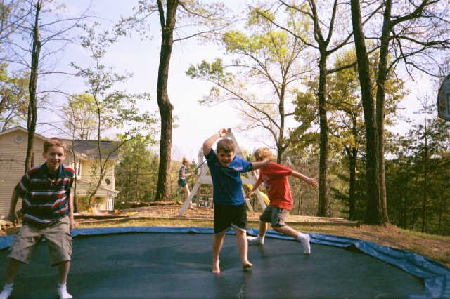 Boys playing on their trampoline at Taccoa GA