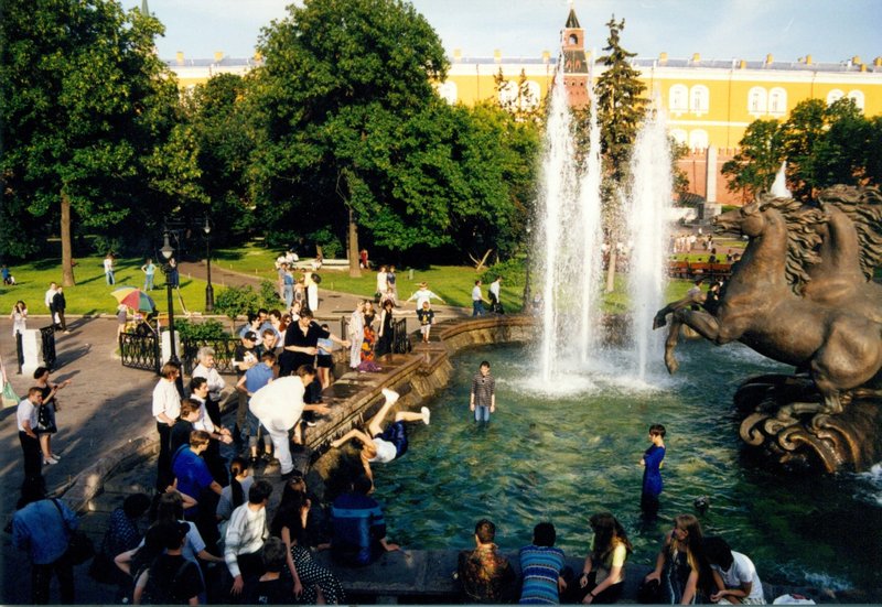 Young people splashing in the fountain next to the Kremlin