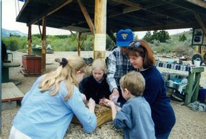 Tamara, Rosanna, Will, and Linda sifting for garnets in Virginia City, Montana