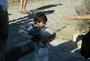 Child selling roses at Sounion