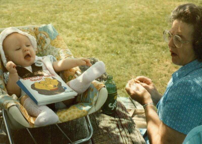 Linda's mom feeding Tamara at the picnic