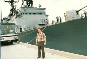Bob in front of a U.S. destroyer at Augusta Bay, Sicily