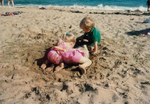 Tamara and Rosanna digging a hole to bury Will at Sand Beach