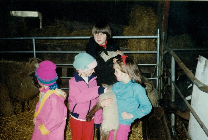 Rosanna, Tamara, Gillian and the farmer's daughter with lambs
