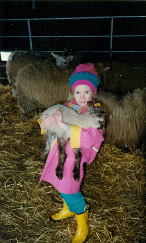 Rosanna holding a lamb