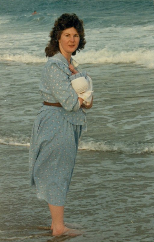 Linda holding Rosanna on the beach at Jupiter Island