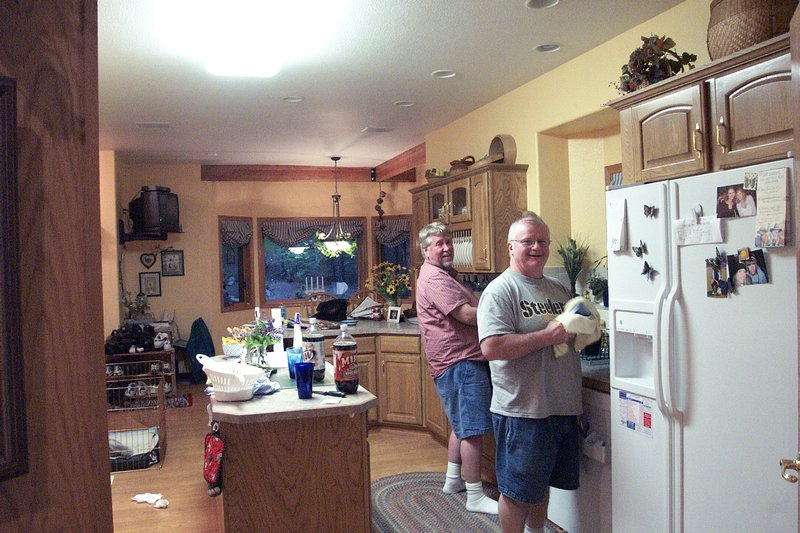 Buz and Bob washing dishes in our kitchen