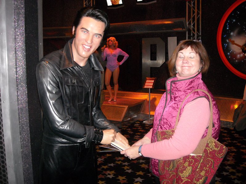 Linda shaking hands with Elvis Presley at Madame Tussaud's Wax Museum