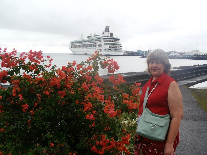 74 Linda posing with bougainvilla flowers in Apia