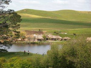 Hobbiton lake with mill, bridge and tavern
