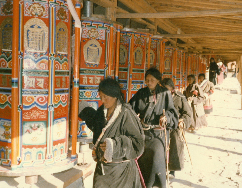 Pilgrims spinning prayer wheels at the Labrang Monastery