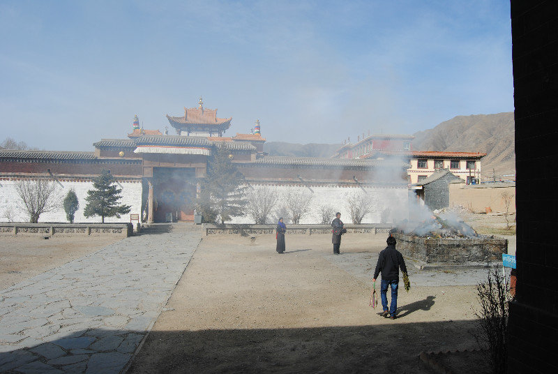 Burning branches from the sacred forest at Labrang Monastery