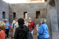 The guide explaining about Inca construction using the Temple of Sun