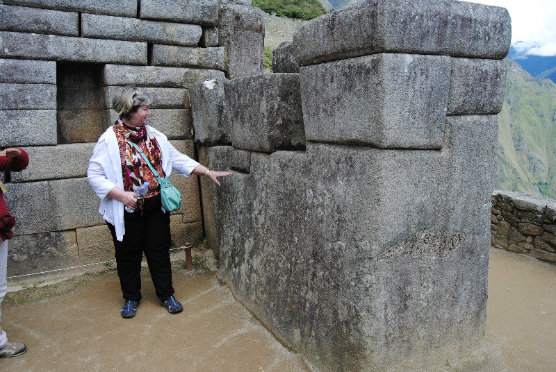 Linda counting the 36 corners of a rock that formed half of an Inca cross, with the other half on the other side of the doorway